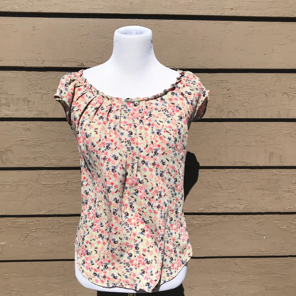 A Lauren Conrad flower T-shirt of 100% polyester.